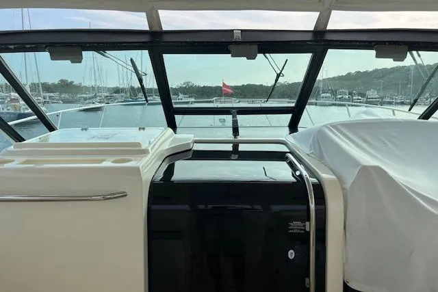 Moxie Yacht Photos Pics 1998 Tiara Yachts 3500 Open cockpit view with marina background.