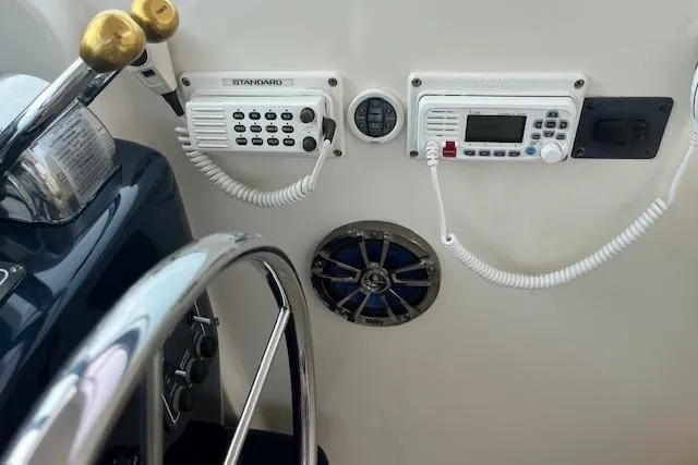 Moxie Yacht Photos Pics 1998 Tiara Yachts 3500 Open helm with radio controls and steering wheel.