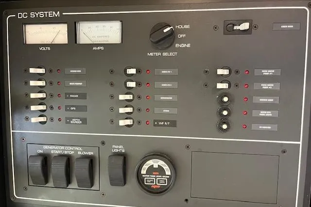 Moxie Yacht Photos Pics Control panel of a 1998 Tiara Yachts 3500 Open, featuring DC system gauges and switches.