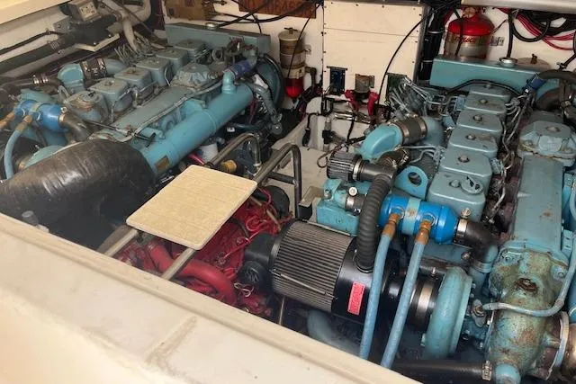 Moxie Yacht Photos Pics Engine room of a 1998 Tiara Yachts 3500 Open, showcasing dual marine engines.