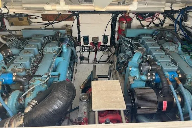 Moxie Yacht Photos Pics Engine room of a 1998 Tiara Yachts 3500 Open, featuring dual marine engines.