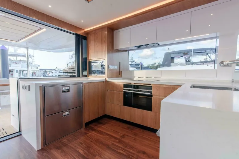 53s Iliad 2026 Yacht Photos Pics Modern kitchen interior on ILIAD 53S yacht, featuring sleek cabinetry and stainless steel appliances, 2026 model.