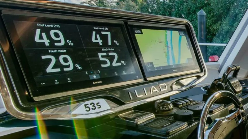 53s Iliad 2026 Yacht Photos Pics Dashboard of ILIAD 53S yacht showing fuel, water levels, and navigation screen, 2026 model.