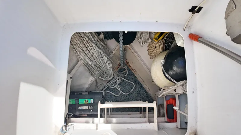 La Vita Marina Yacht Photos Pics Interior view of 1993 Holland Marine 50 Custom Trawler storage compartment with ropes and equipment.