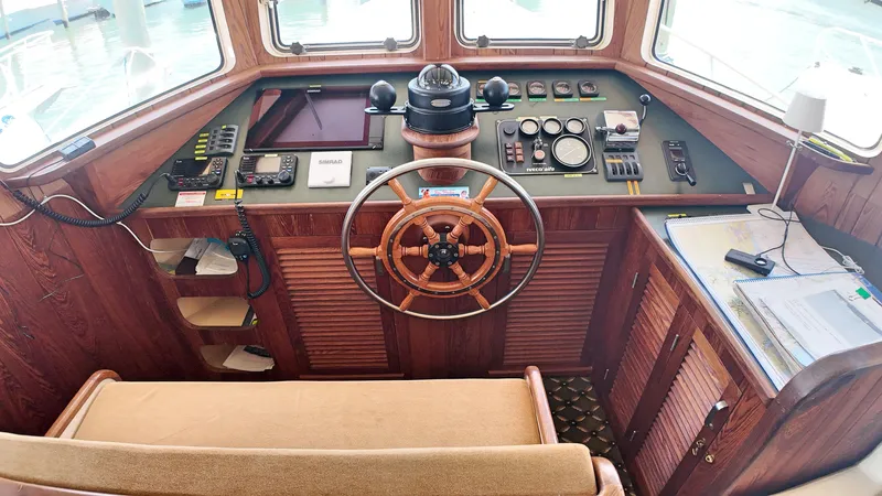 La Vita Marina Yacht Photos Pics 1993 Holland Marine 50 Custom Trawler helm with wooden wheel and navigation instruments.