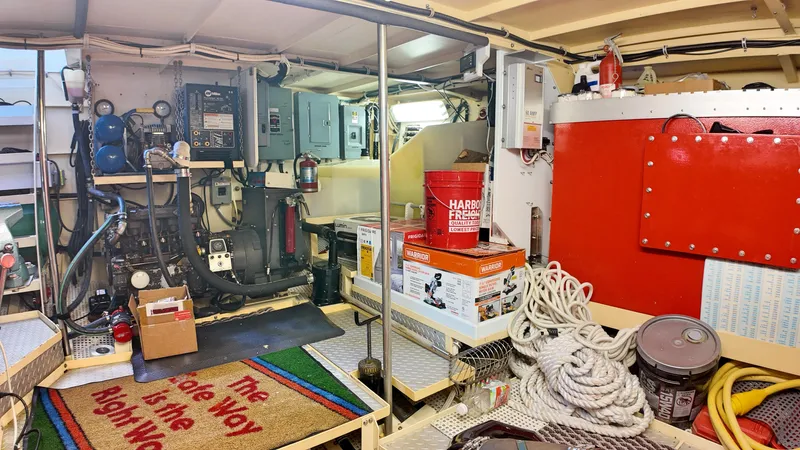 La Vita Marina Yacht Photos Pics Engine room of 1993 Holland Marine 50 Custom Trawler with equipment and supplies.