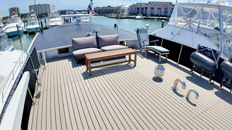 La Vita Marina Yacht Photos Pics Spacious deck of 1993 Holland Marine 50 Custom Trawler with seating and marina view.