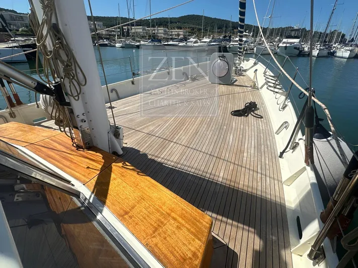  Yacht Photos Pics Spacious deck of 1987 Custom Galtarossa Motorsailer, docked in a marina with clear skies.