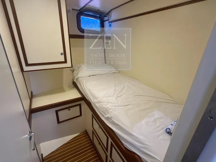  Yacht Photos Pics Cozy cabin interior of 1987 Galtarossa Motorsailer, featuring a single bed and wooden accents.