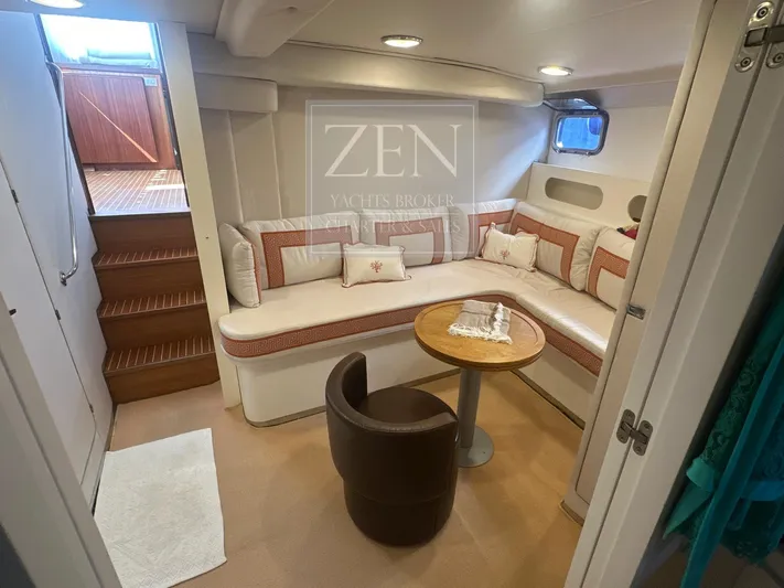  Yacht Photos Pics Interior of 1987 Custom Galtarossa Motorsailer, featuring cozy seating and wooden table.