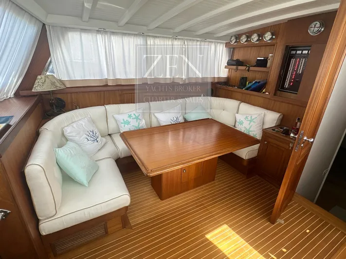  Yacht Photos Pics Luxurious interior of 1987 Galtarossa Motorsailer with elegant wood finish and cozy seating area.