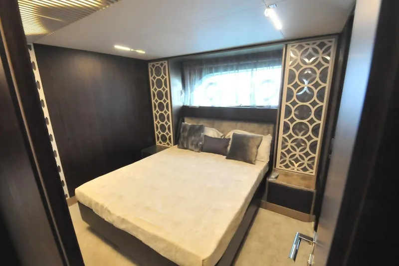  Yacht Photos Pics Luxurious bedroom interior on a 2017 Ferretti Yachts 850, featuring elegant decor and comfortable bedding.