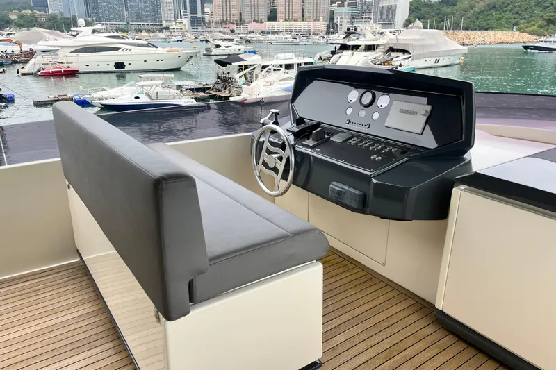  Yacht Photos Pics Helm of 2017 Ferretti Yachts 850 with city marina view.