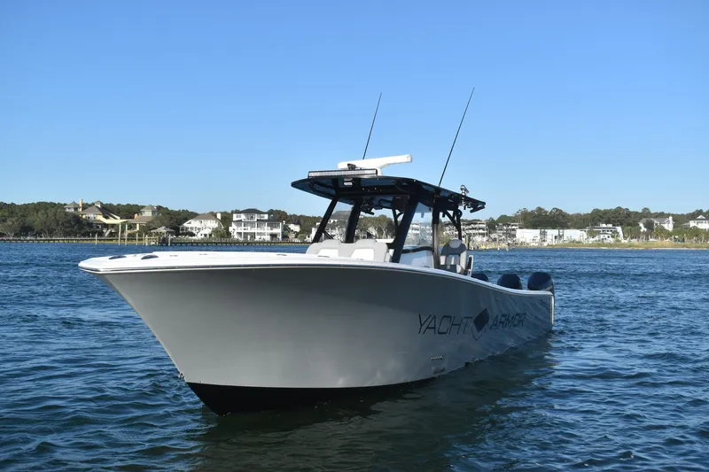 Main Event Yacht Photos Pics 2023 Front Runner 39 Center Console boat on calm water, clear sky background.