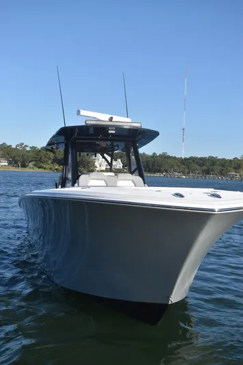 Main Event Yacht Photos Pics 2023 Front Runner 39 Center Console boat on calm water, clear sky background.