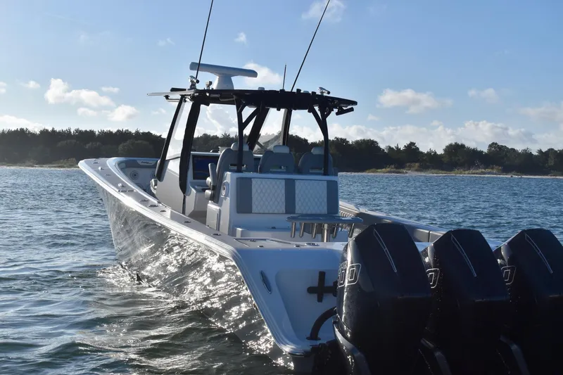 Main Event Yacht Photos Pics 2023 Front Runner 39 Center Console boat on water, featuring multiple outboard engines.