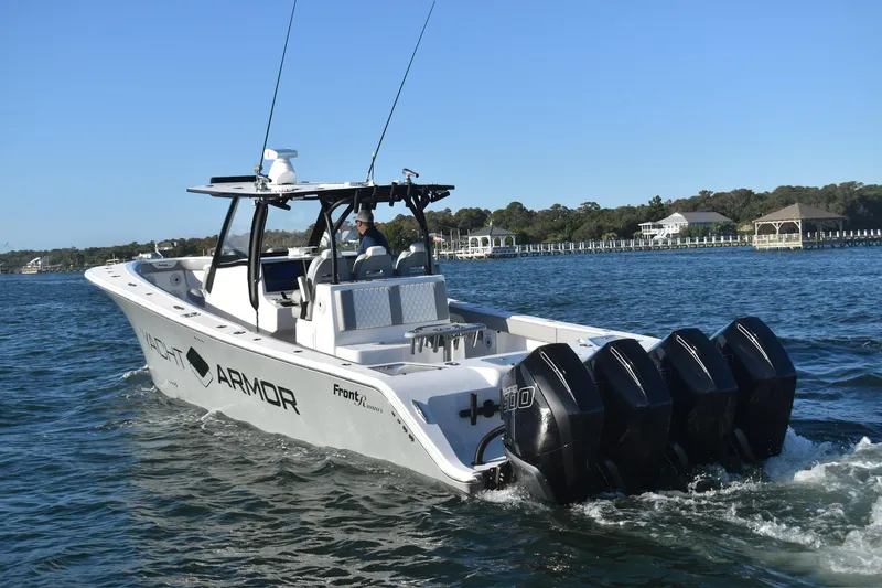 Main Event Yacht Photos Pics 2023 Front Runner 39 Center Console boat cruising on water with four engines.