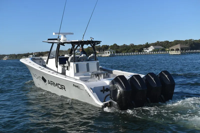 Main Event Yacht Photos Pics 2023 Front Runner 39 Center Console boat cruising on water with four engines.