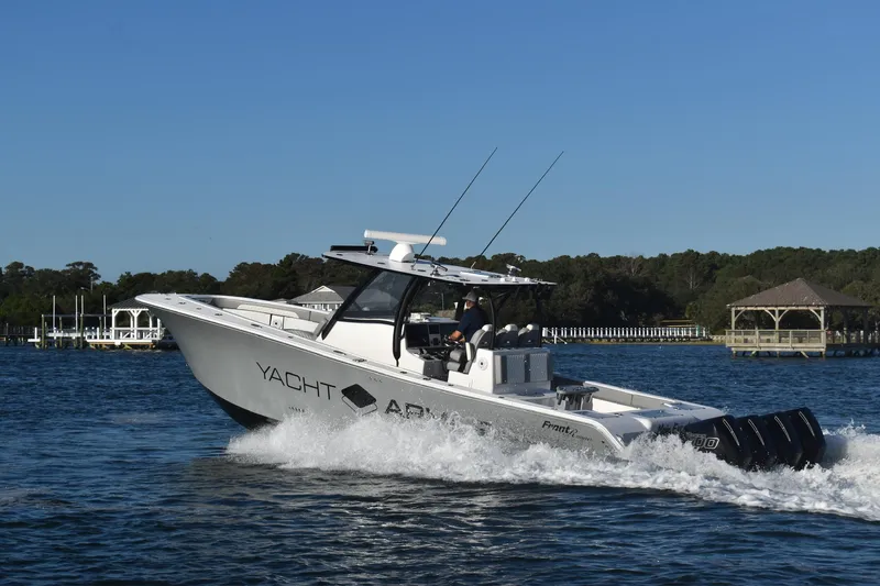 Main Event Yacht Photos Pics 2023 Front Runner 39 Center Console boat cruising on a sunny day.