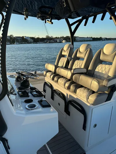 Main Event Yacht Photos Pics 2023 Front Runner 39 Center Console boat interior with luxurious seating and control panel.