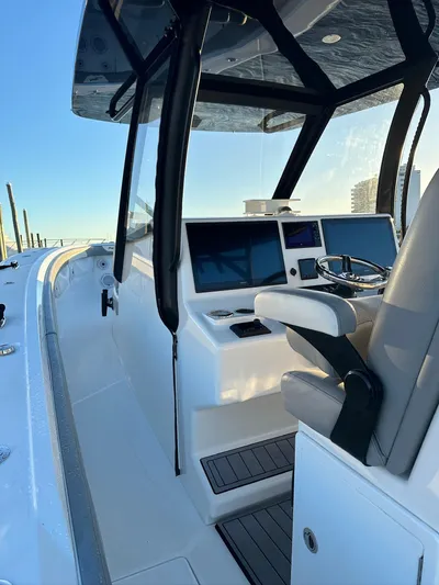 Main Event Yacht Photos Pics 2023 Front Runner 39 Center Console boat interior with modern helm and seating.