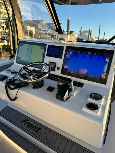 Main Event Yacht Photos Pics 2023 Front Runner 39 Center Console helm with advanced navigation displays and controls.