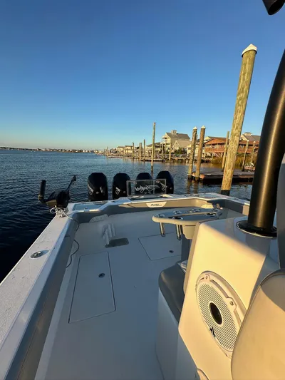 Main Event Yacht Photos Pics 2023 Front Runner 39 Center Console boat docked by the waterfront at sunset.