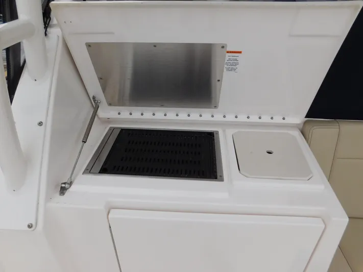  Yacht Photos Pics 2018 Pursuit OS 325 Offshore boat grill and sink station.