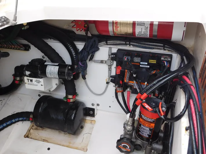  Yacht Photos Pics Engine compartment of a 2018 Pursuit OS 325 Offshore boat, showing wiring and components.
