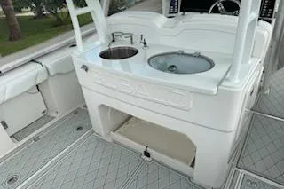  Yacht Photos Pics 2019 Robalo R300 Center Console boat interior with sink and storage area.