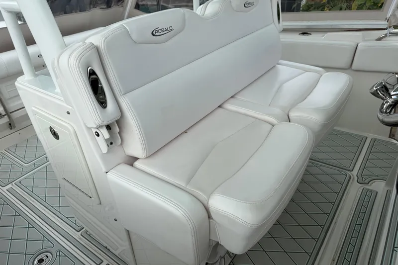  Yacht Photos Pics 2019 Robalo R300 Center Console boat with white cushioned seating and sleek interior design.