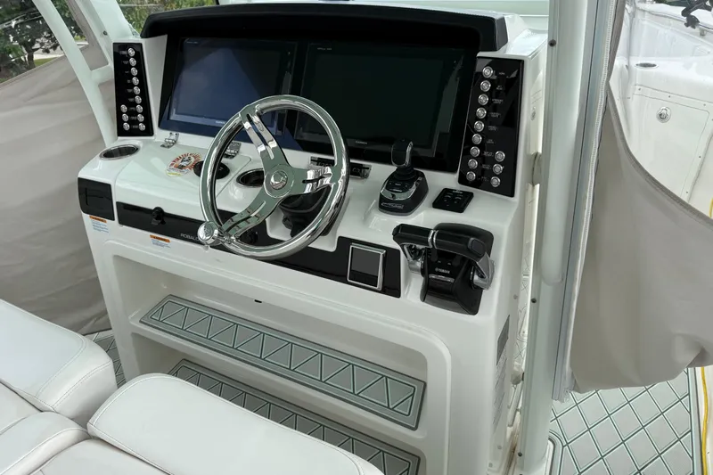  Yacht Photos Pics 2019 Robalo R300 Center Console helm with modern controls and dual displays.
