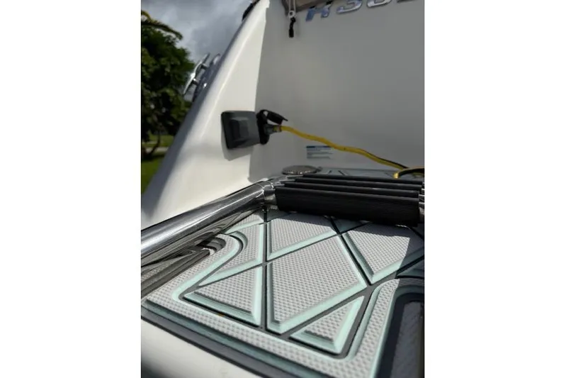  Yacht Photos Pics 2021 Robalo R300 Center Console boat deck with ladder and textured mat.