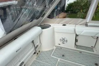  Yacht Photos Pics 2021 Robalo R300 Center Console boat interior with cushioned seating and storage compartments.