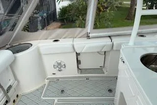  Yacht Photos Pics 2021 Robalo R300 Center Console boat interior with white seating and deck.