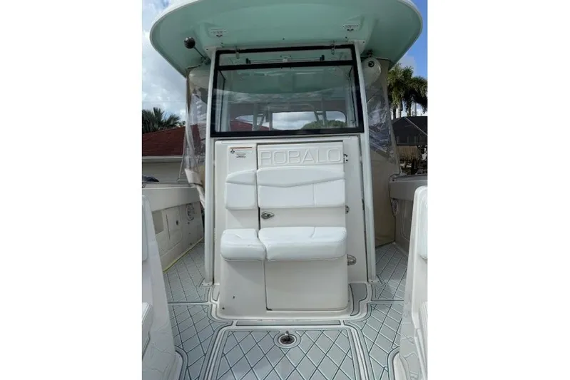  Yacht Photos Pics 2021 Robalo R300 Center Console boat interior with seating and helm area.