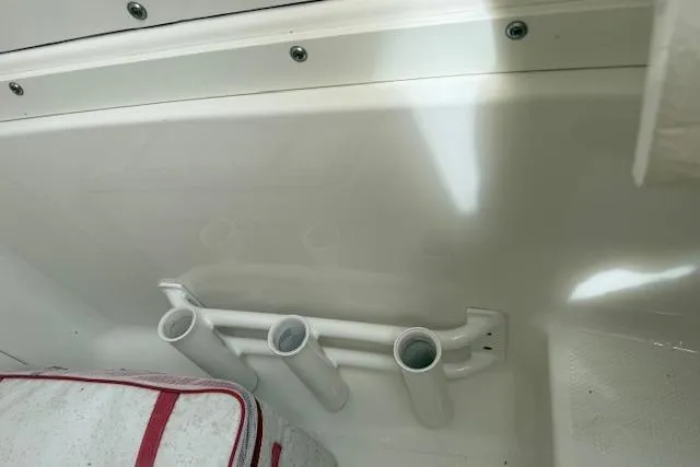  Yacht Photos Pics 2021 Robalo R300 Center Console interior with rod holders and cushioned seating.