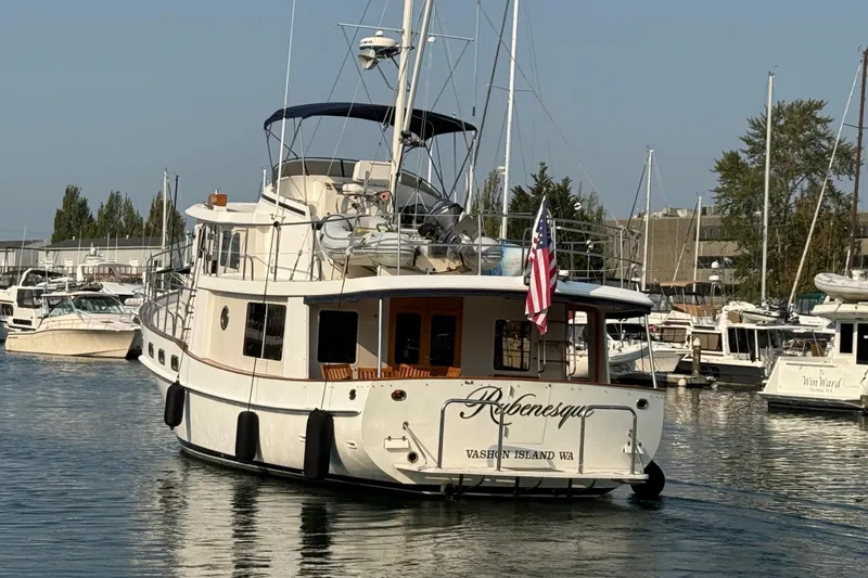  Yacht Photos Pics 1998 Kadey-Krogen 48' Northsea Widebody Pilothouse yacht docked in marina, rear view.