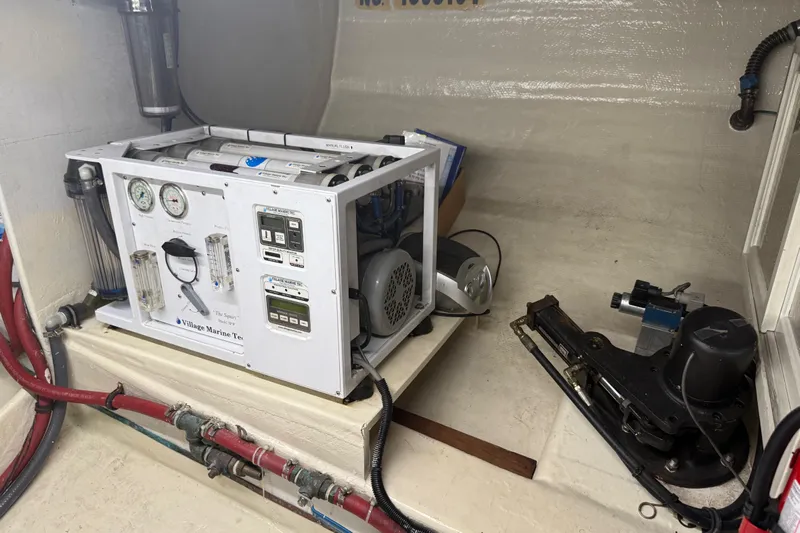  Yacht Photos Pics Engine room of 1998 Kadey-Krogen 48' Northsea Widebody Pilothouse with marine equipment.