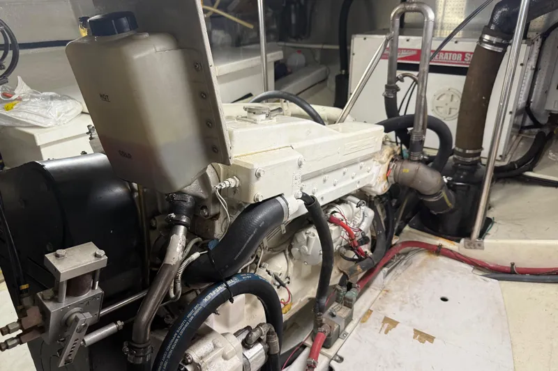  Yacht Photos Pics Engine room of 1998 Kadey-Krogen 48' Northsea Widebody Pilothouse, showcasing mechanical components.