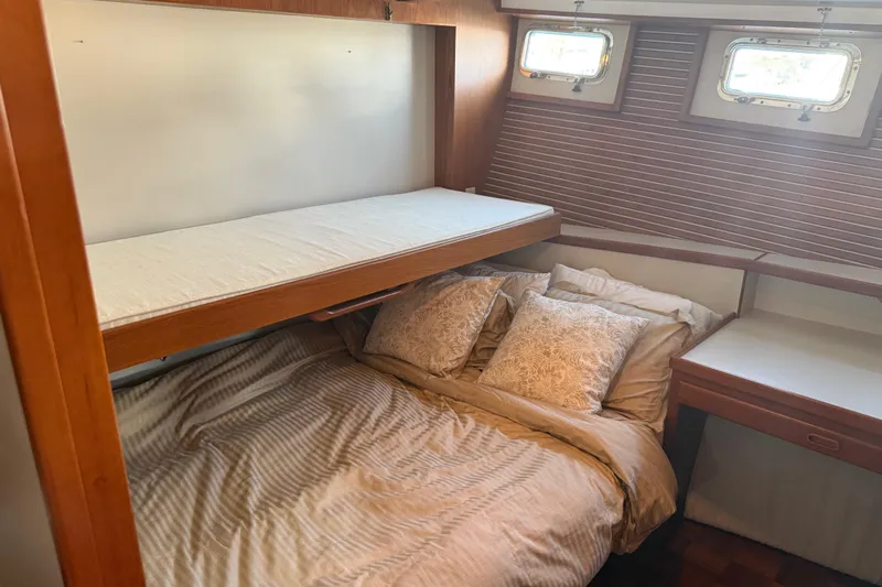  Yacht Photos Pics Cozy cabin interior of 1998 Kadey-Krogen 48' Northsea Widebody Pilothouse with bunk beds.