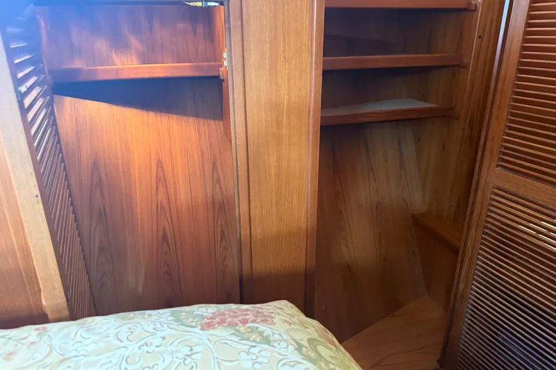  Yacht Photos Pics Wooden interior of 1998 Kadey-Krogen 48' Northsea Widebody Pilothouse with shelves and closet.