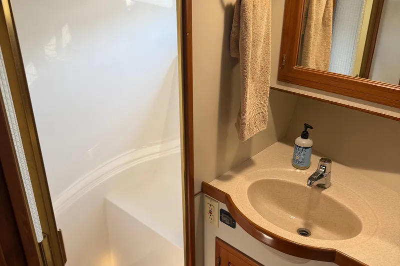  Yacht Photos Pics Bathroom interior of 1998 Kadey-Krogen 48' Northsea Widebody Pilothouse with sink and shower.