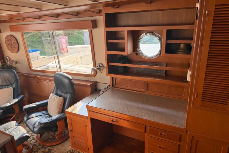 Yacht Photos Pics Interior of 1998 Kadey-Krogen 48' Northsea Widebody Pilothouse with wooden cabinetry and seating.