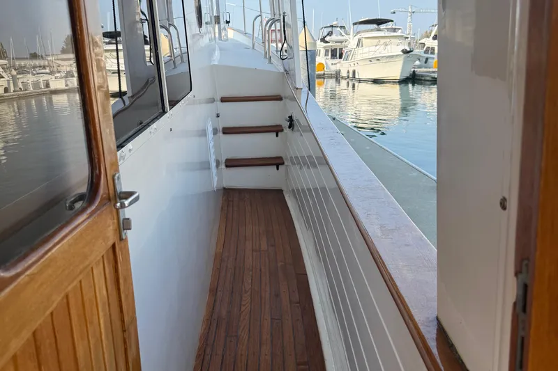  Yacht Photos Pics Kadey-Krogen 48' Northsea Widebody Pilothouse, 1998, wooden deck, marina view.