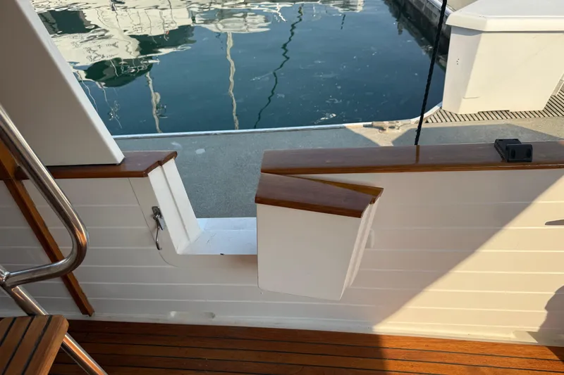  Yacht Photos Pics Kadey-Krogen 48' Northsea Widebody Pilothouse, 1998, dockside view with wooden deck and open gate.