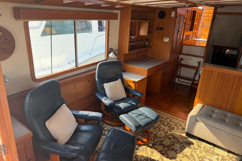  Yacht Photos Pics Interior of 1998 Kadey-Krogen 48' Northsea Widebody Pilothouse with cozy seating and wooden accents.