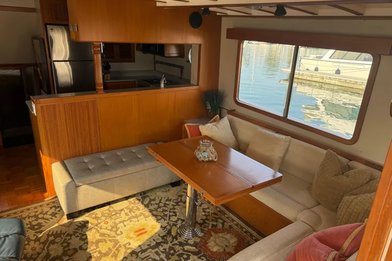  Yacht Photos Pics Interior of 1998 Kadey-Krogen 48' Northsea Widebody Pilothouse with cozy seating and kitchen.