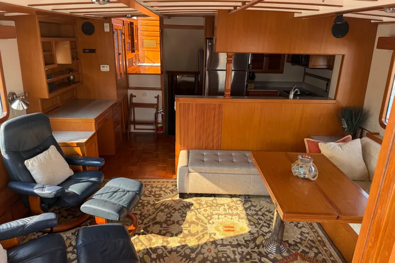  Yacht Photos Pics Interior of 1998 Kadey-Krogen 48' Northsea Widebody Pilothouse with cozy seating and wooden finishes.