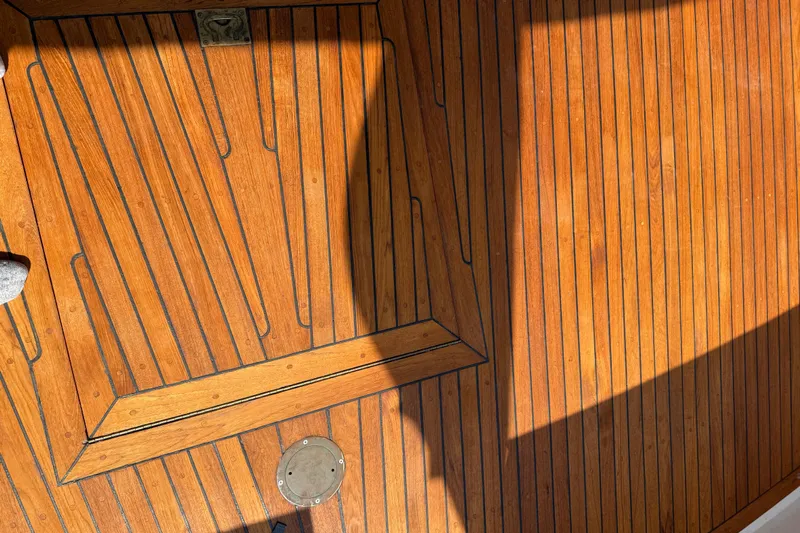  Yacht Photos Pics Teak deck of 1998 Kadey-Krogen 48' Northsea Widebody Pilothouse, showcasing wood grain and shadows.